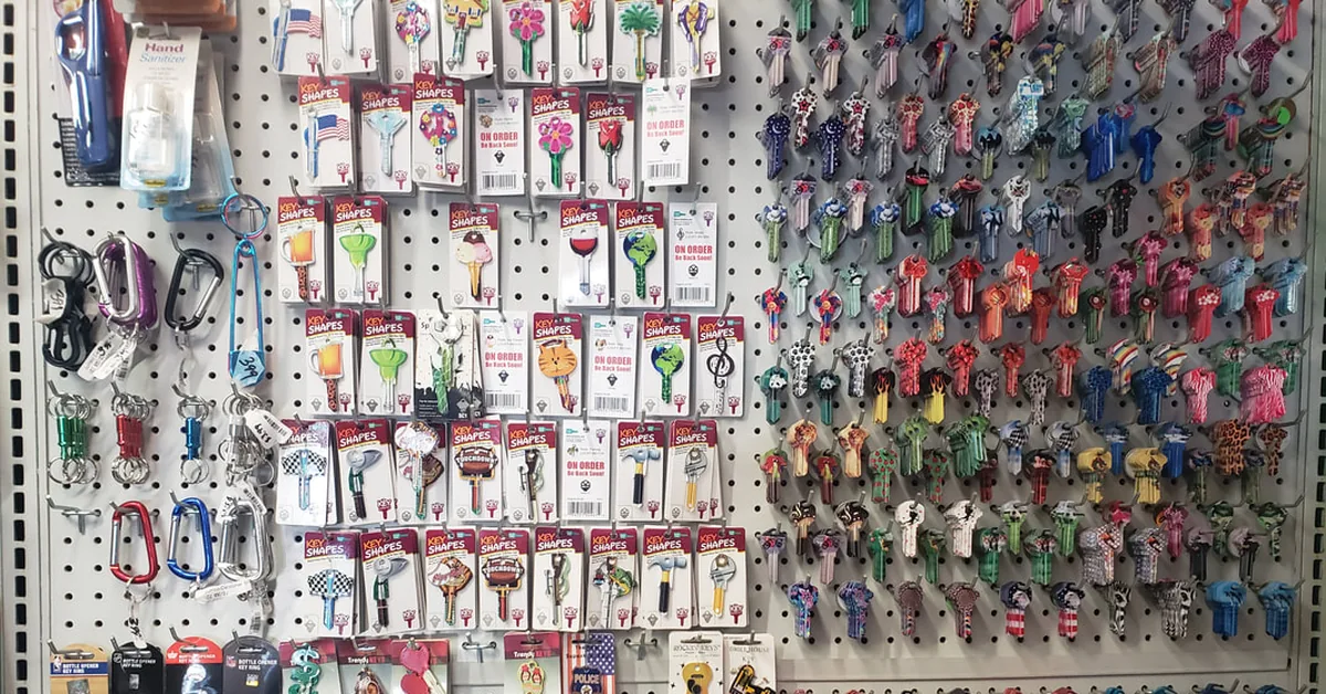Colorful key blanks and key rings fill the wall inside the full service locksmith and hardware store.