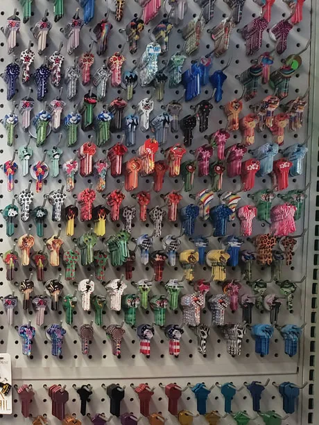 Hundreds of colored key blanks hang on hooks along the key wall inside Jerry's Hardware & Car Keys.